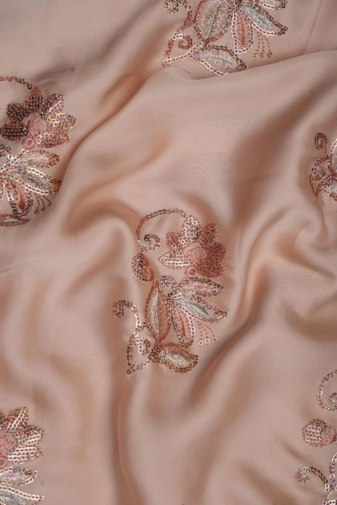 Beige fabric with floral embroidery in rose gold