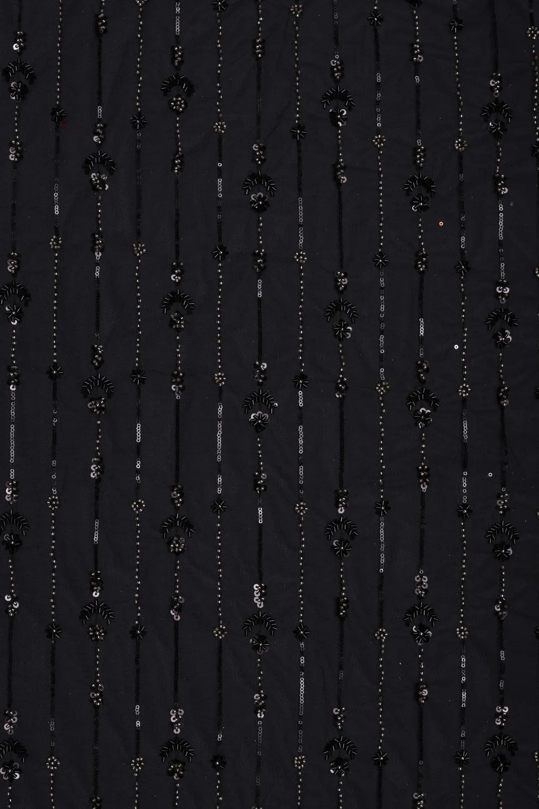 Black fabric with floral and bead patterns