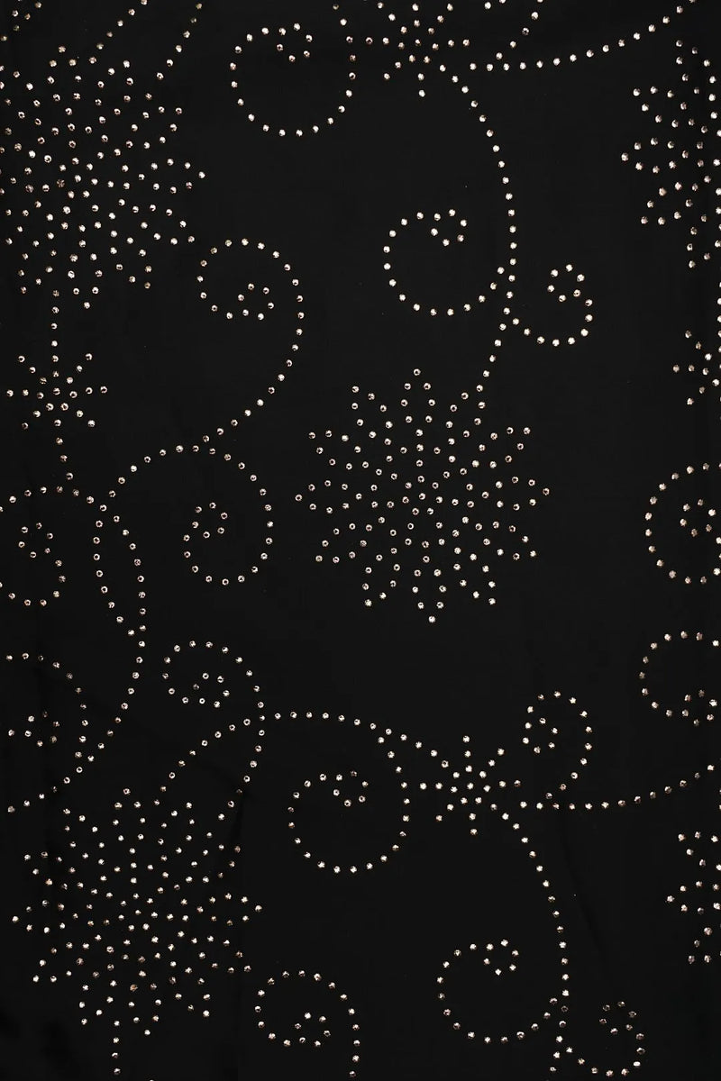Black fabric with white rhinestone patterns