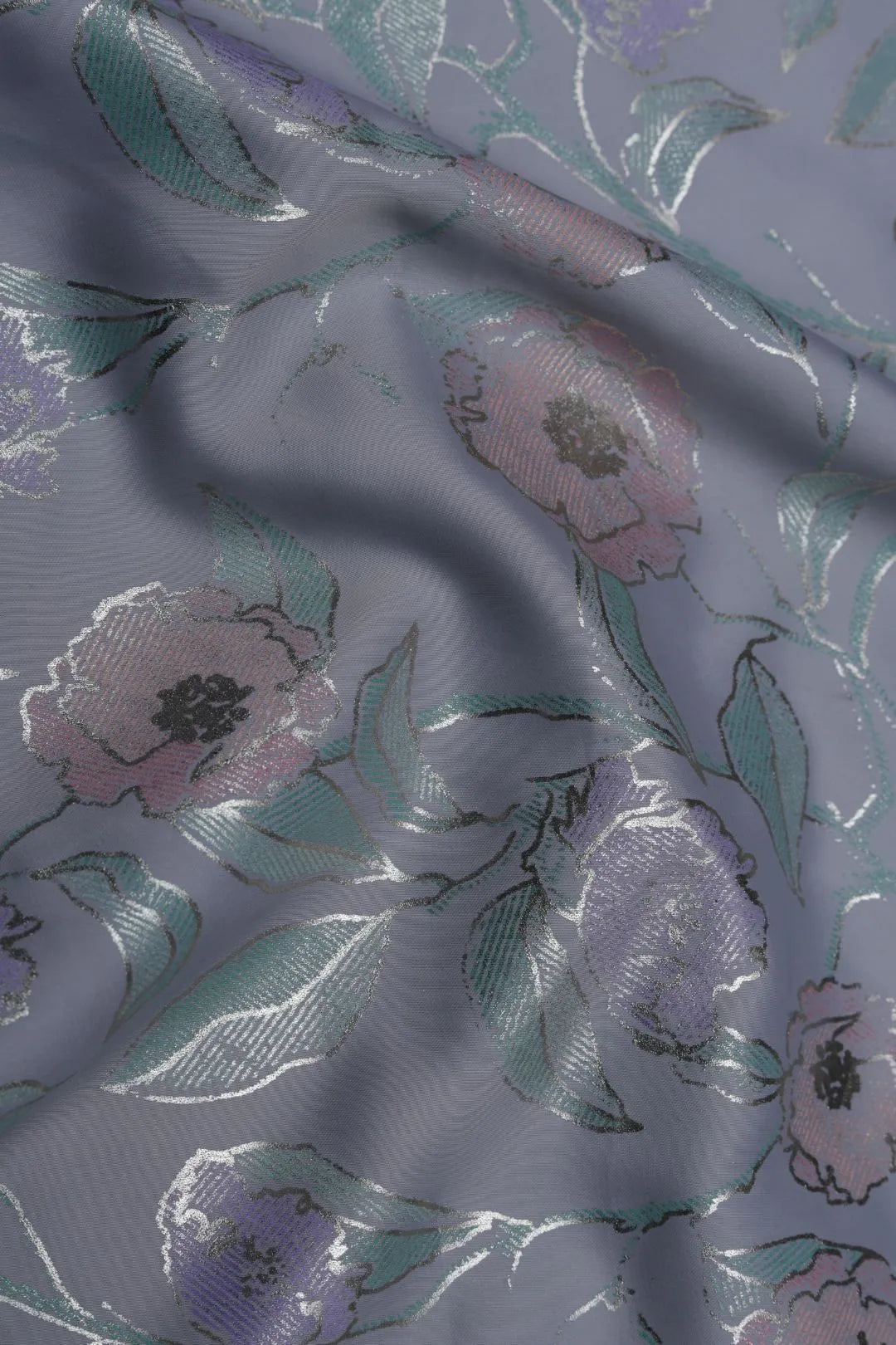 Floral patterned fabric with pink and green flowers