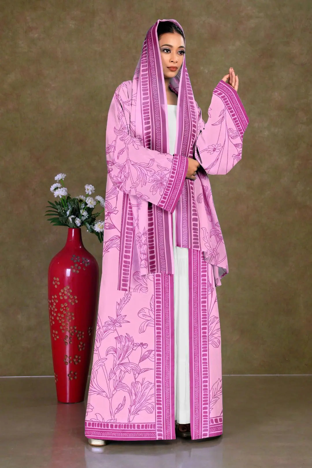 Woman wearing a pink embroidered Shrug