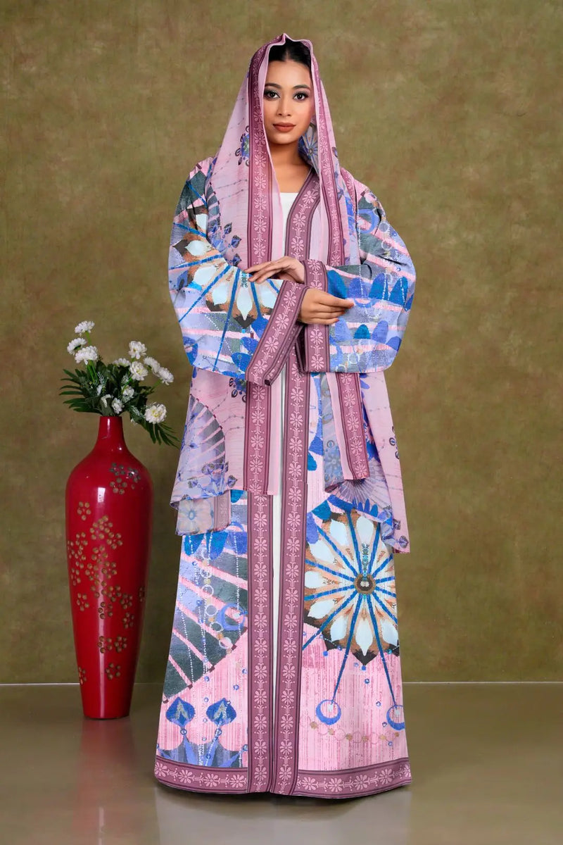 Woman wearing a colorful patterned shrug with a matching headscarf