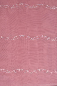 Pink fabric with decorative white stitching pattern