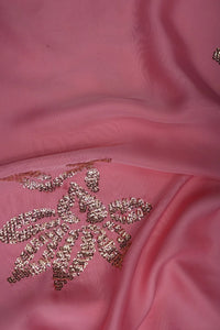 Pink fabric with gold embroidered design