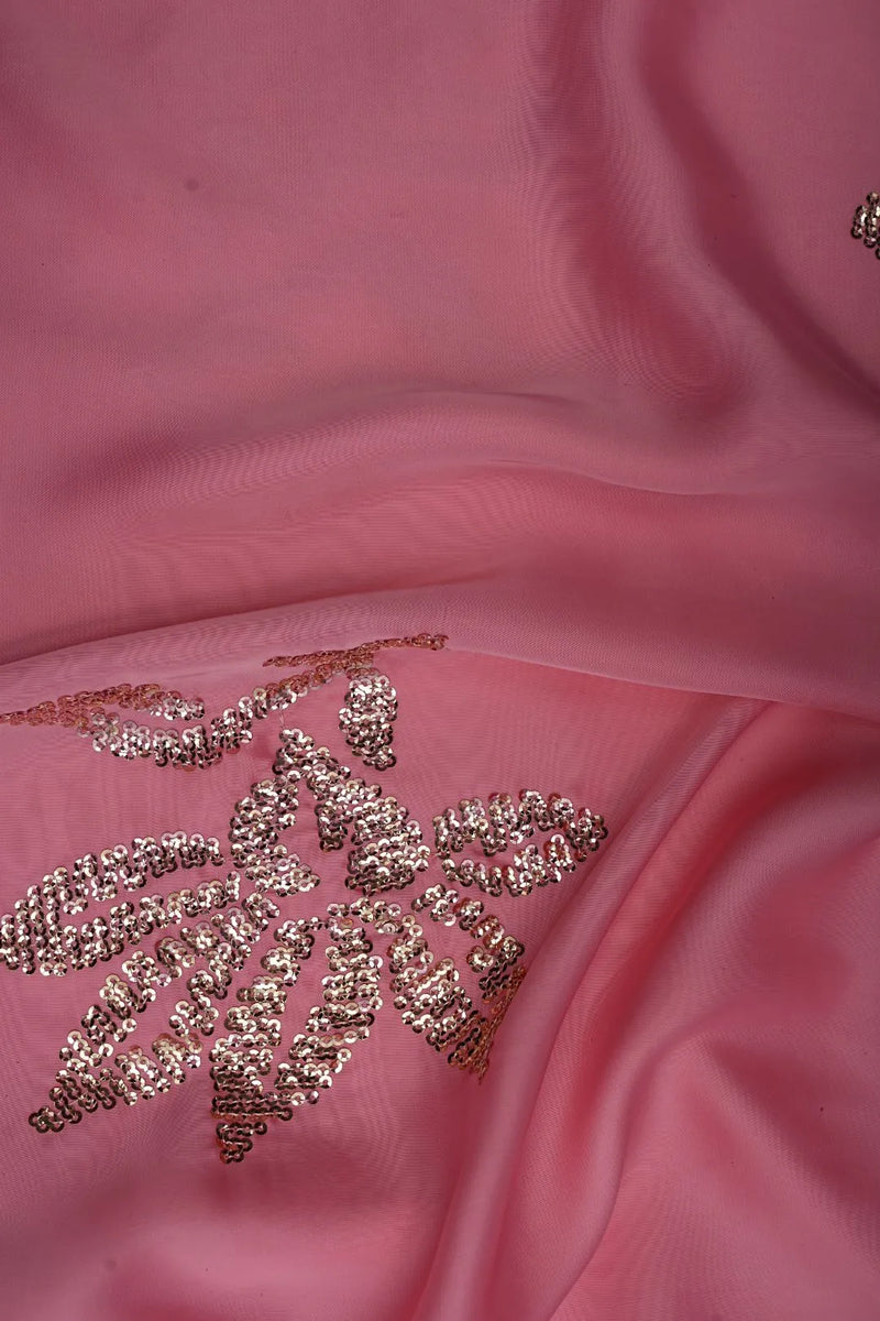 Pink fabric with gold embroidered design