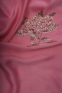 Pink fabric with gold embroidered designs