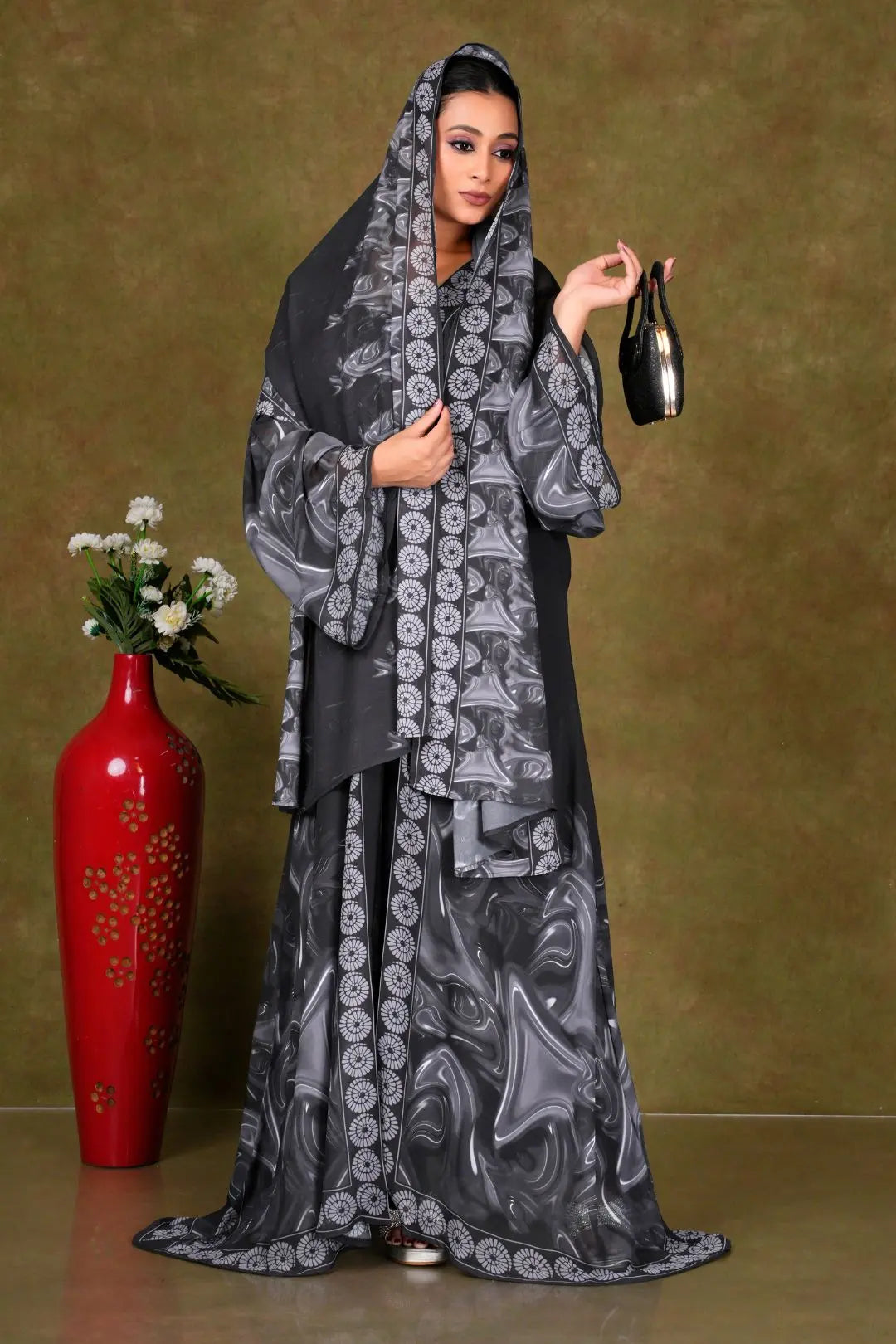 Woman in a black and gray patterned shrug gajiwala export