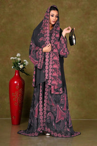 Woman wearing a black and maroon patterned shrug gajiwala export