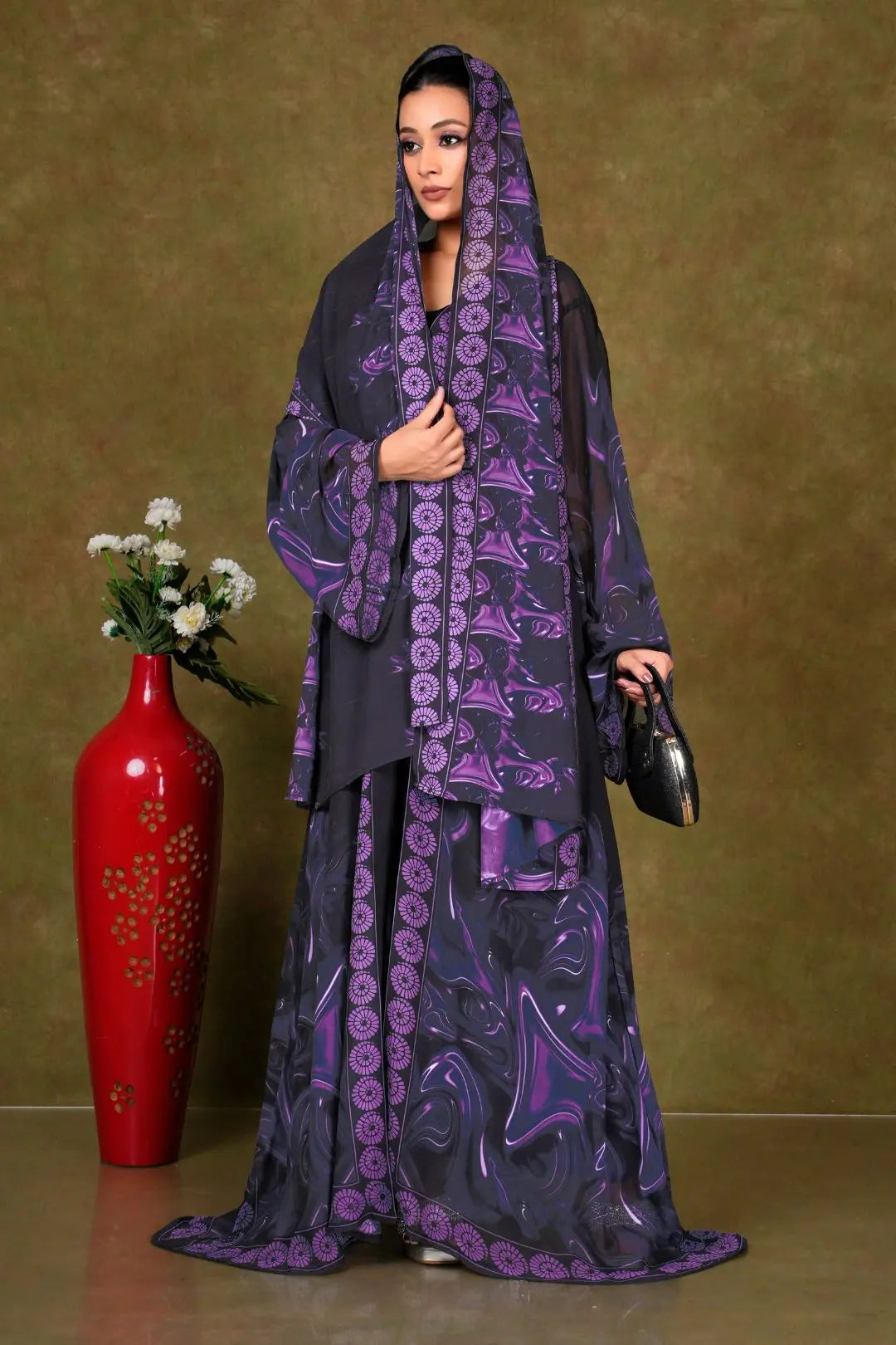 Woman wearing a dark purple and black patterned shrug gajiwala export