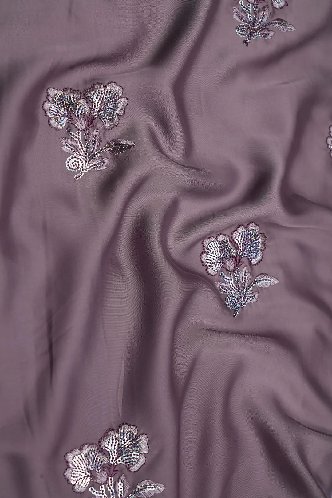 Purple fabric with floral embroidery