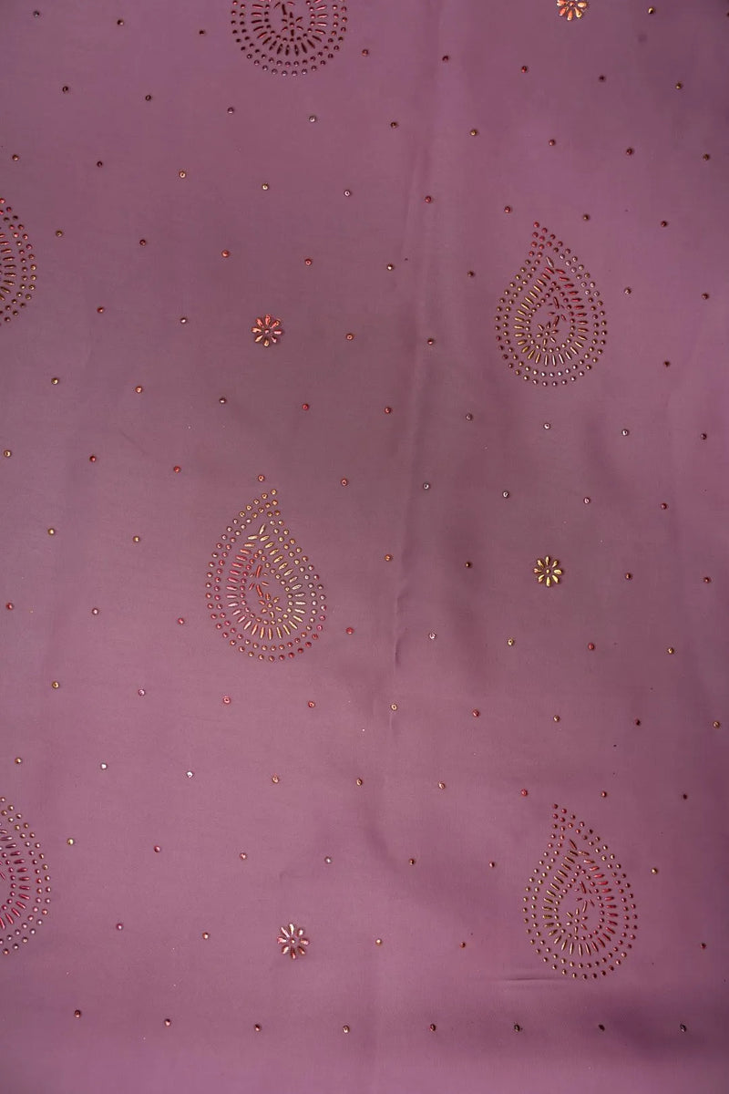 Purple fabric with intricate gold embroidery patterns