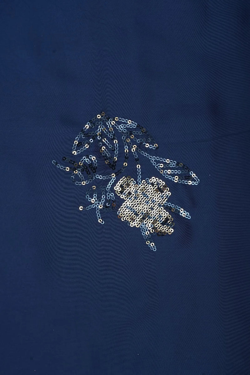 Sequined design on a dark blue fabric