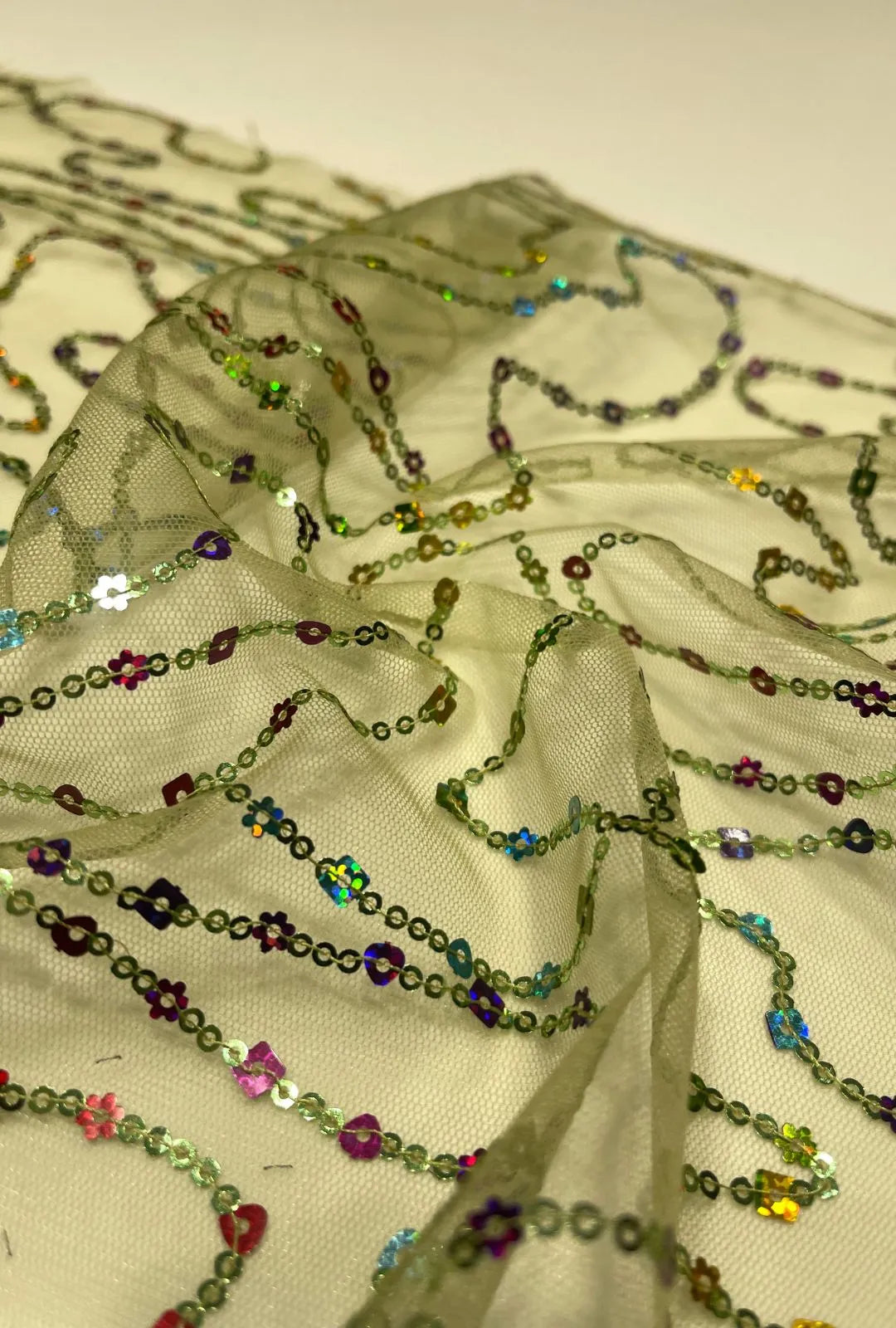 Sinuous Linear Multi-Shaped Sequence Embroidered Net Fabric