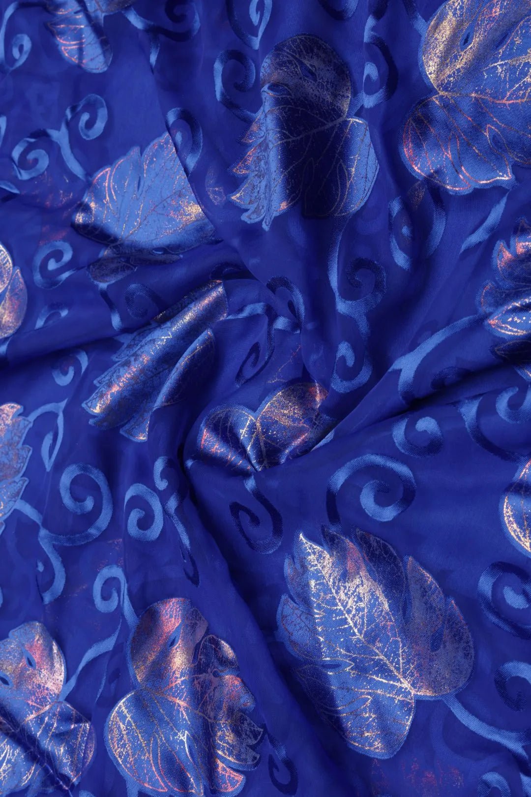 Blue Brasso Fabricwith Multi - Tonal Metallic Foil Leaves - غاجي والا إكسبورت Gajiwala Export