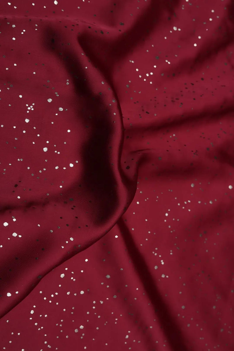 Maroon Fabric with Scattered Silver Foil Print - غاجي والا إكسبورت Gajiwala Export