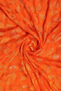 Orange Brasso fabric  with Shimmering Trailing Leaf Motif - غاجي والا إكسبورت Gajiwala Export