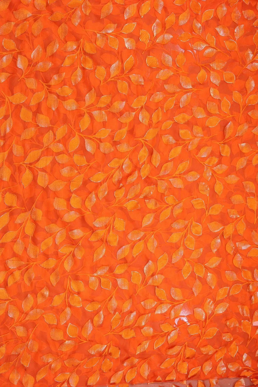 Orange Brasso fabric with Shimmering Trailing Leaf Motif - غاجي والا إكسبورت Gajiwala Export