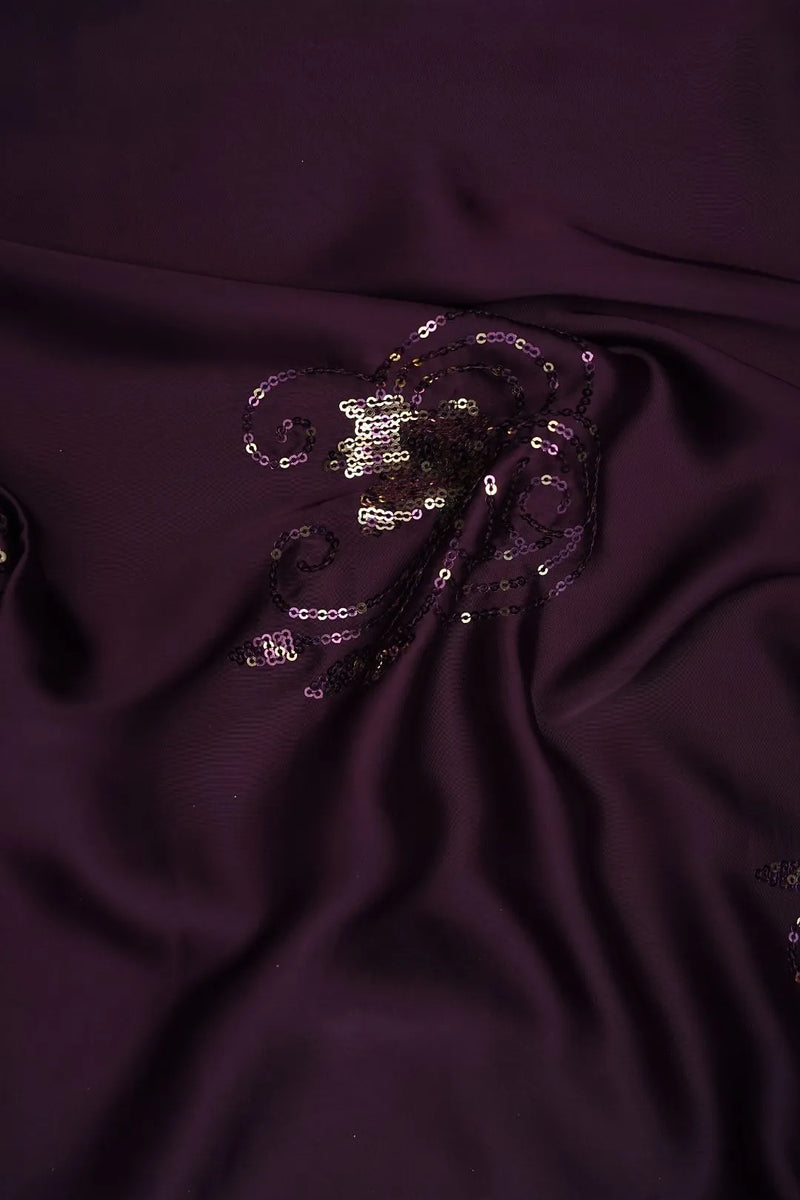 purple fabric with a sequin embellishment