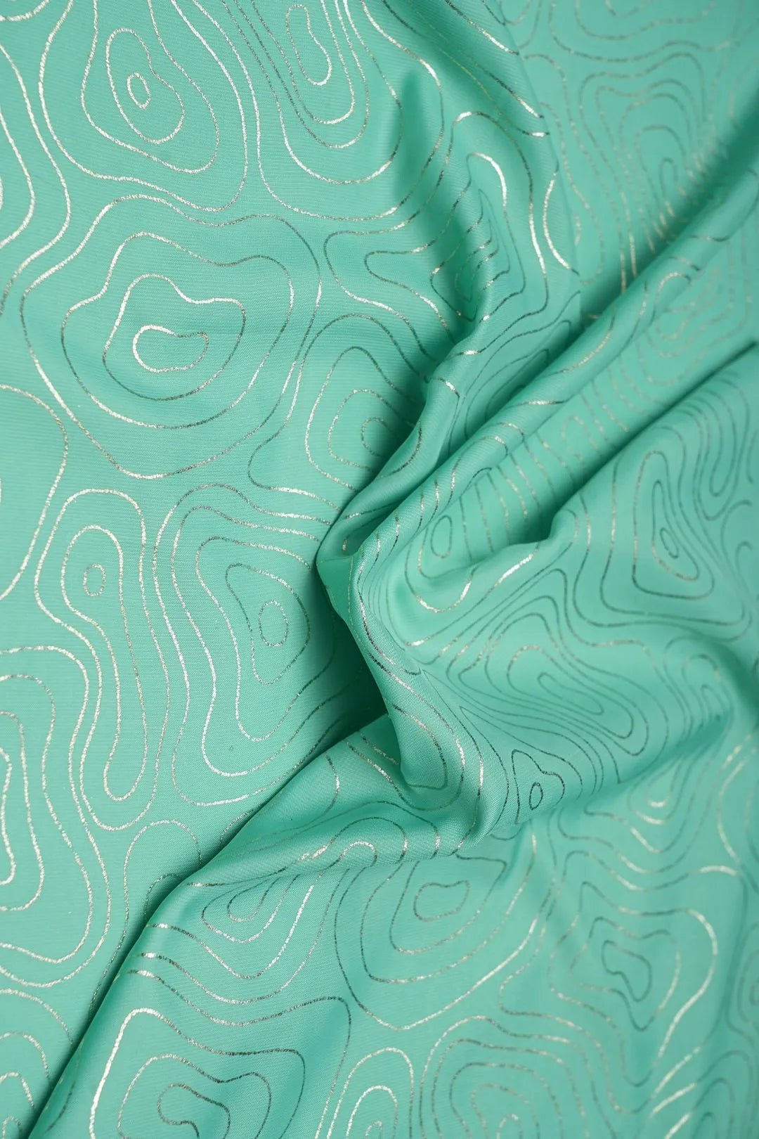 Silver Metallic Contour Print on Sea Green Fabric - غاجي والا إكسبورت Gajiwala Export