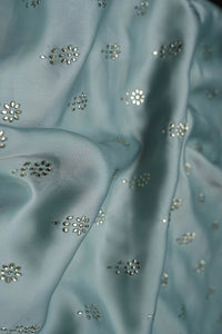 Sky Blue Fabric with Scattered Silver Floral Buti - غاجي والا إكسبورت Gajiwala Export